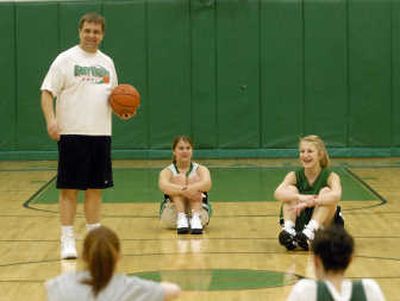 
Rob Collins, the new East Valley varsity girl's basketball coach, trys to bring a relaxed approach to the game as well as make it fun for the girls while playing well. 
 (J. BART RAYNIAK / The Spokesman-Review)