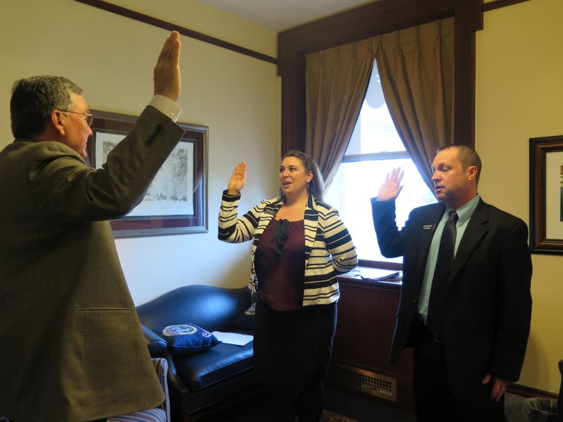 House Speaker Scott Bedke swears in substitute Reps. Brooke Green, left, and Mitch Minnette, right, on Monday morning, March 27, 2017. (Betsy Z. Russell)
