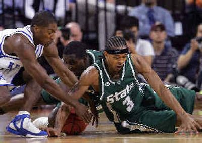 
MSU's Shannon Brown (3) fights for a loose ball.
 (Associated Press / The Spokesman-Review)