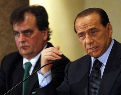 
Italian Premier Silvio Berlusconi, right, talks alongside Reforms Minister Roberto Calderoli at a Feb. 9 news conference.  Berlusconi asked Calderoli to resign  Friday for a controversial TV appearance. 
 (File Associated Press / The Spokesman-Review)