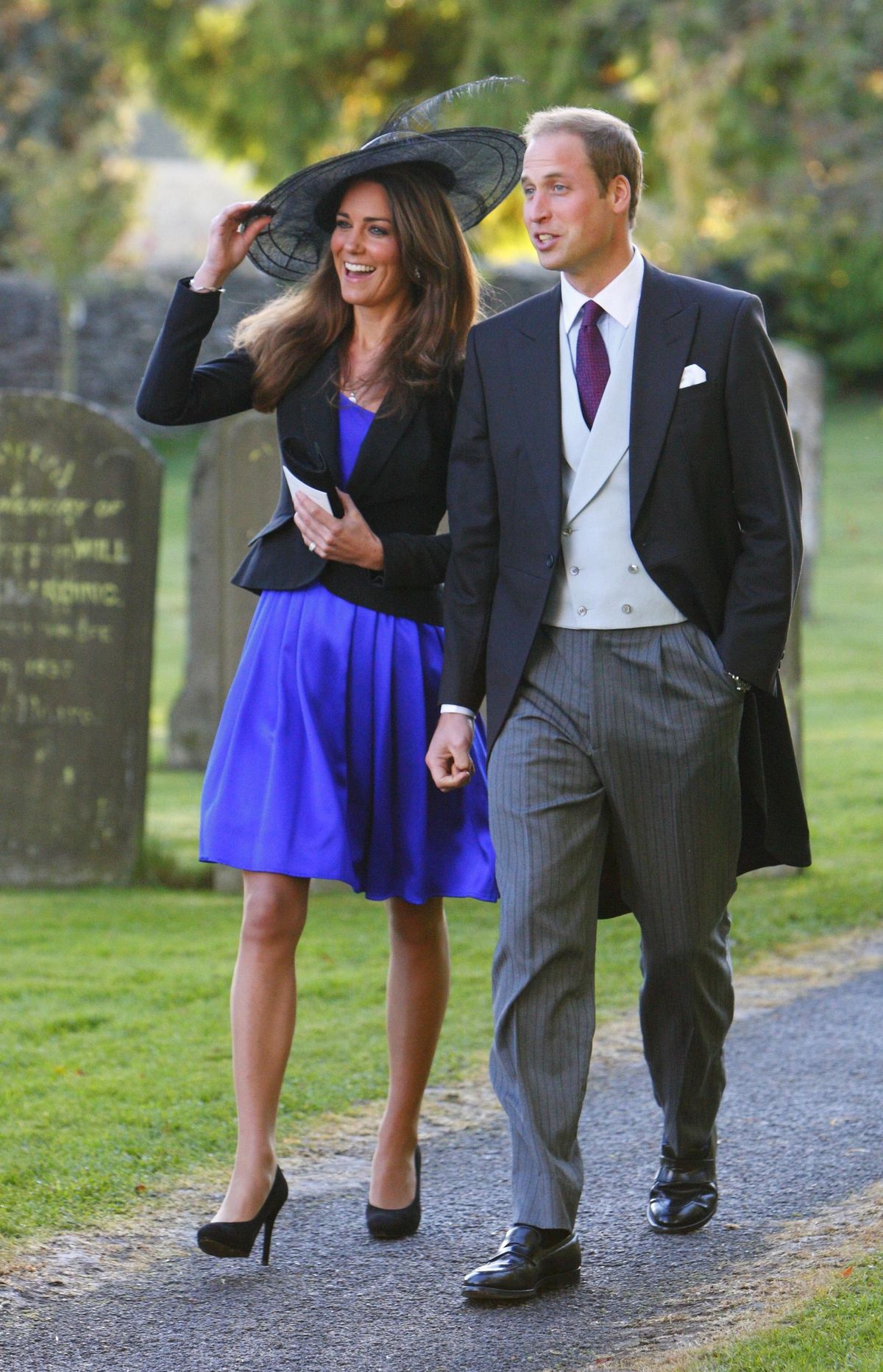 Britain’s Prince William and Kate Middleton leave the wedding of their friends Harry Mead and Rosie Bradford in the village of Northleach, England, last month. The couple announced their engagement Tuesday. (Associated Press)