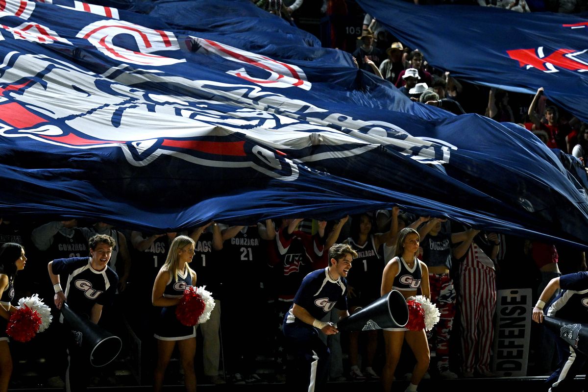 The Zags student section covers up during the San Francisco player introductions during a NCAA college basketball game, Thursday, Jan. 25, 2024, in the McCarthey Athletic Center.  (COLIN MULVANY)