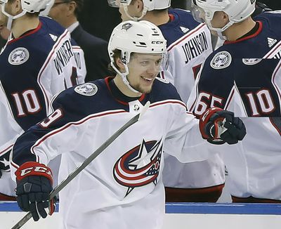 In this March 20, 2018, file photo, Columbus Blue Jackets left wing Artemi Panarin is congratulated by teammates after scoring a goal against the New York Rangers. On Thursday, Panarin, now with the New York Rangers, decried the lack of freedom of expression in his home country and put the blame on Russian President Vladimir Putin. (Julie Jacobson / AP)