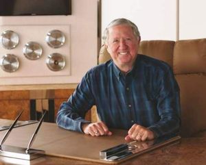 Jerry Jaeger is seen at his desk at the Hagadone Corporation offices in Coeur d’Alene. He has worked for more than four decades for Hagadone Hospitality. (Courtesy of Quicksilver Photography via Coeur d'Alene Press)