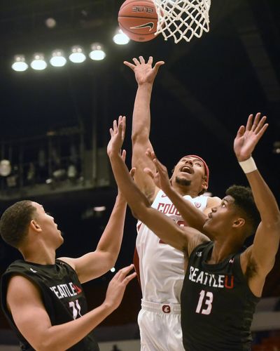 Washington State forward Deion James (20) attempts a shot as Seattle center Jordan Dallas (21) and guard Morgan Means (13) defend during the first half of an NCAA college basketball game Thursday, Nov. 7, 2019, in Pullman, Wash. (Pete Caster / AP)