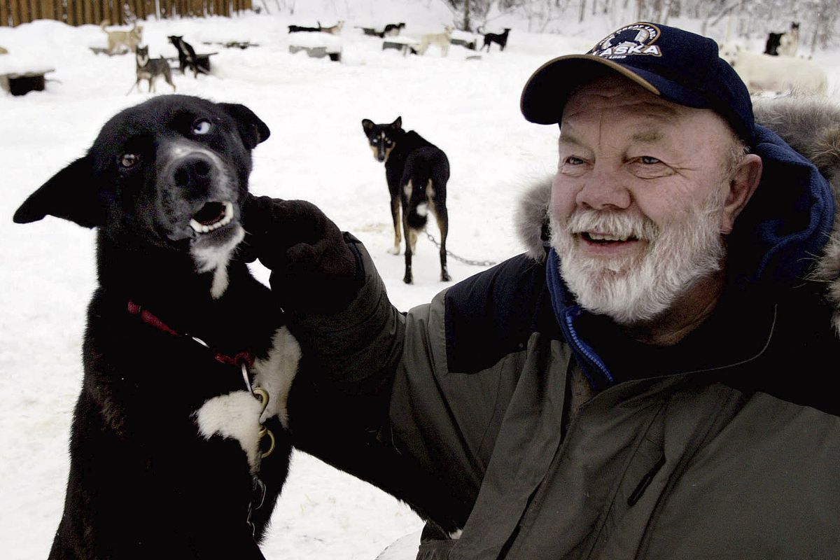 Author Gary Paulsen sits with his favorite Alaskan husky, Flax, at his Willow, Alaska, home on Feb. 10, 2005. Paulsen died Wednesday, Oct. 13, 2021 at age 82.  (AL GRILLO)