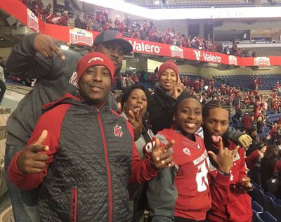 Members of Renard Bell’s family pose for a photo before Washington State’s appearance in the 2018 Alamo Bowl. Bell, a Los Angeles native and senior wide receiver for the Cougars, will be traveling home for Sunday’s game at USC but won’t have an opportunity to see family and friends.  (Reginald Bell/Courtesy)