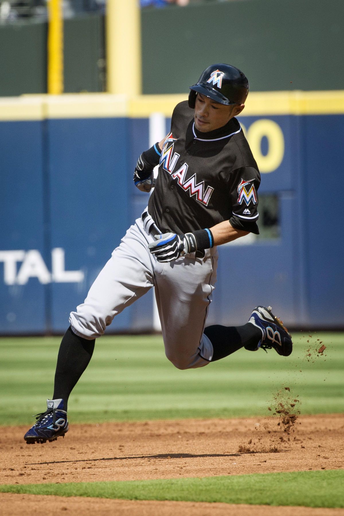 Miami Marlins’ Ichiro Suzuki turns the corner at second base on an RBI-triple during the third inning of a baseball game, against the Atlanta Braves, Saturday, July 2, 2016, in Atlanta. (John Amis / Associated Press)