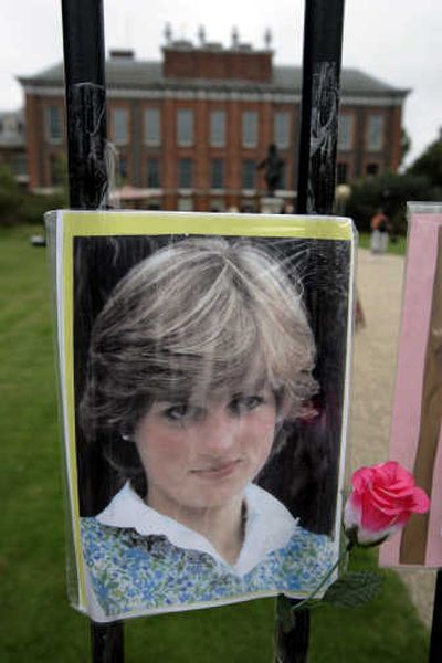 
A photograph and a plastic flower in memory of  Princess Diana are seen within the grounds of Kensington Palace in London. Associated Press
 (Associated Press / The Spokesman-Review)