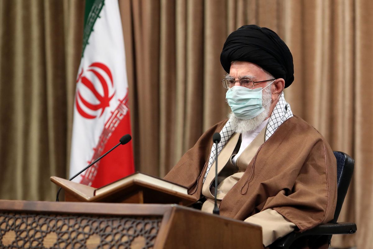 In this picture released by an official website of the office of the Iranian supreme leader, Supreme Leader Ayatollah Ali Khamenei wearing a protective face mask, attends a meeting in Tehran, Iran, Wednesday, April 14, 2021. Khamenei said Wednesday that the offers being made at the Vienna talks over his country