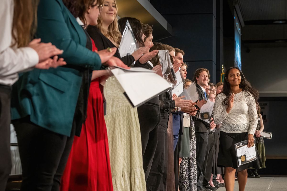 Gonzaga Prep senior Hawwi Jebena, winner of the $5,000 scholarship for fine arts, steps out to accept her award Monday in the Spokane Convention Center. (COLIN MULVANY/THE SPOKESMAN-REVIEW)
