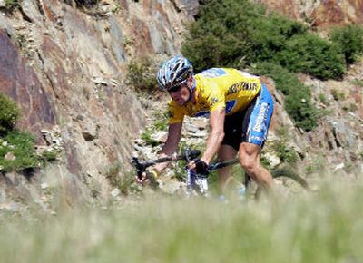 
Overall leader Lance Armstrong rides down the Pailheres pass on during the 14th stage of the Tour de France Saturday.  
 (Associated Press / The Spokesman-Review)