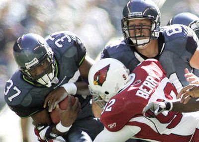 
Seattle's Shaun Alexander plowed through the Arizona Cardinals' defense for 140 yards and four touchdowns during the Seahawks' 37-12 win on Sept. 25. 
 (Associated Press / The Spokesman-Review)