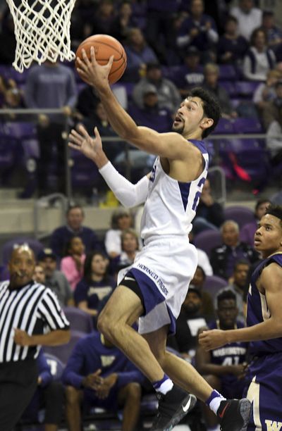 TCU’s Alex Robinson scores in front of Washington’s Markelle Fultz during the first half  Wednesday. (Bob Haynes / Associated Press)