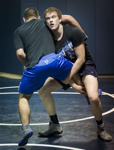 Wildcats’ Tom Harvey breezed to regional title with three straight pins. (Colin Mulvany)