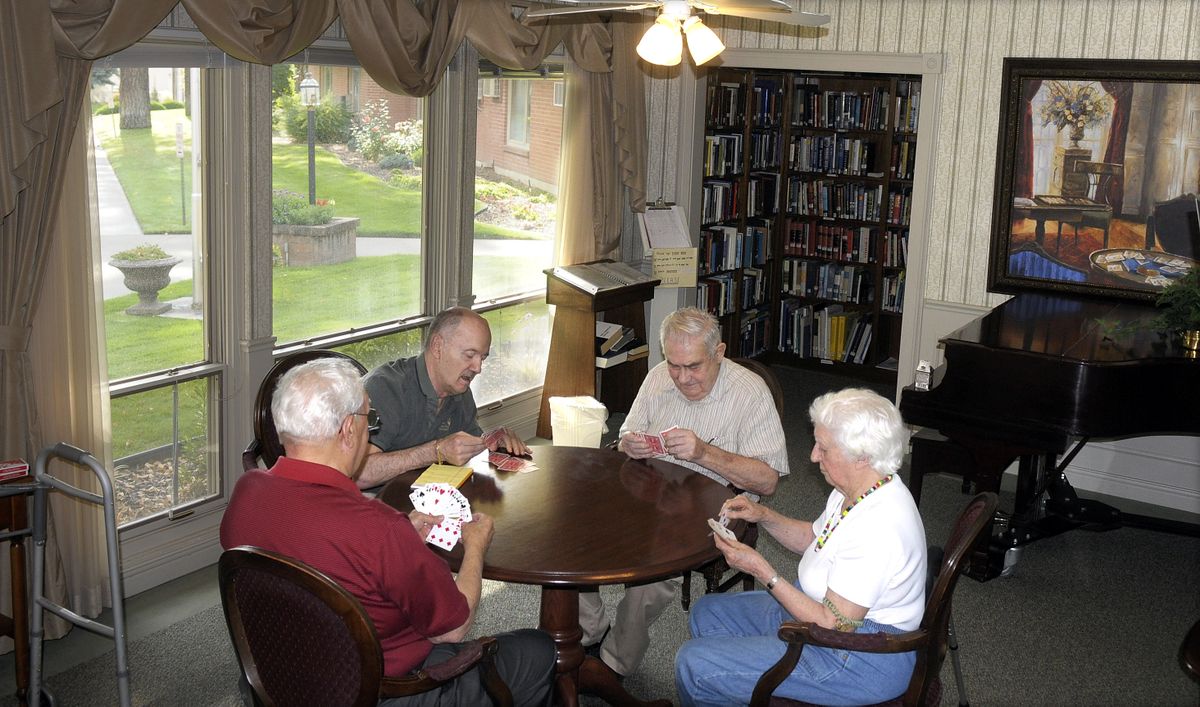 From left,  Hubert Randall, Doug Lungo, George Hoffman and Audrey Woods get together for a game of Bridge in the lobby of Rockwood at Hawthorne last Thursday.  (Photos by Christopher Anderson / The Spokesman-Review)