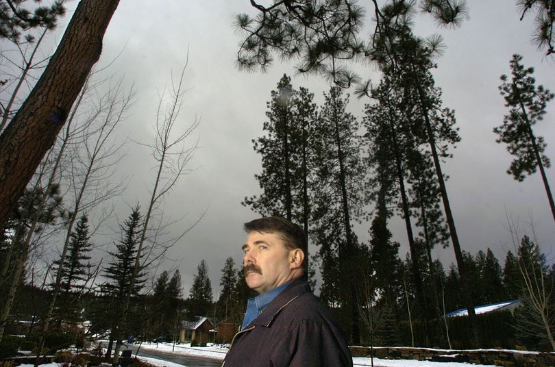 Kootenai County sheriff’s Sgt. Brad Maskell stands in the area where newspaper carrier Gary Loesch was murdered in November 1995. Two years later, his widow, Barbara, was found slain at her Post Falls home. (Christopher Anderson / The Spokesman-Review)