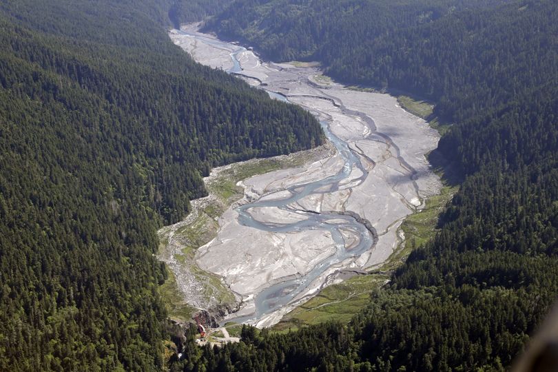 The free-flowing Elwha River makes its way through what was Lake Mills and past the old Glines Canyon Dam, bottom, in Olympic National Park near Port Angeles, Wash., in June. (Associated Press)