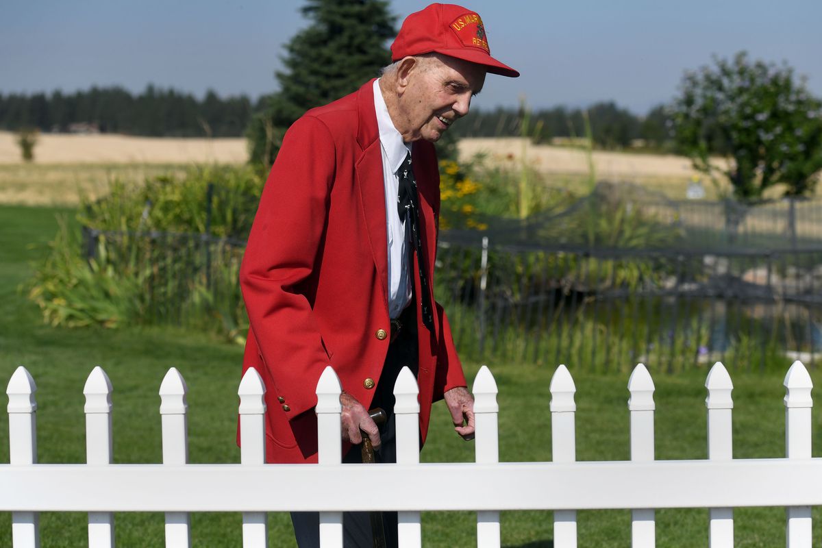 WWII veteran Dean Ladd walks through his yard in Spokane recently. He was set to participate in V-J anniversary ceremonies on Sept. 2.  (Kathy Plonka/The Spokesman-Review)