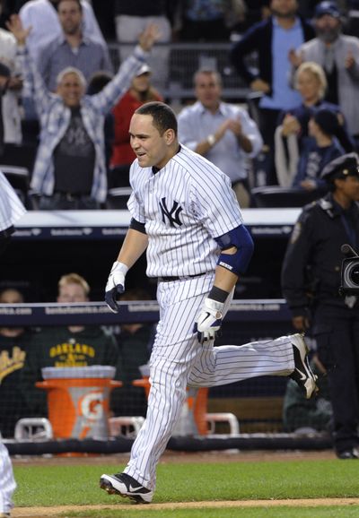 Yankees’ Russell Martin celebrates winning homer against Oakland. (Associated Press)