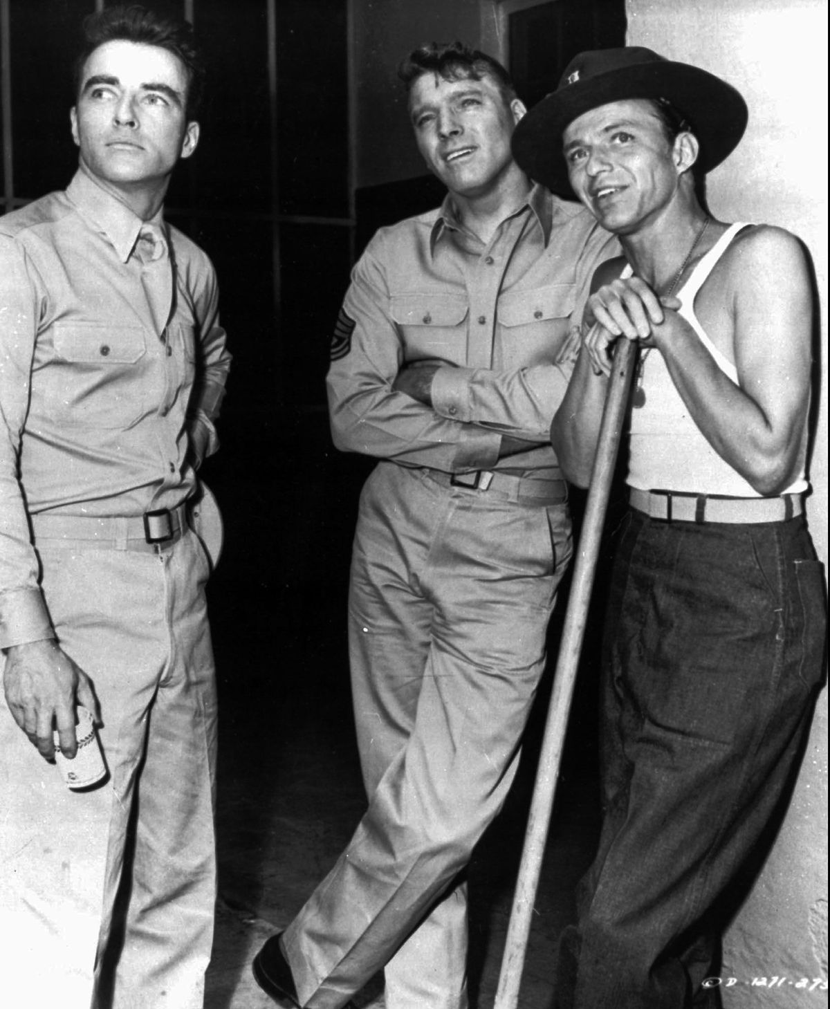 Frank Sinatra, right, stands with fellow actors Montgomery Cliff, left, and Burt Lancaster in this scene from the film “From Here to Eternity.” Sinatra’s performance won him an Oscar as best supporting actor in 1953. (Associated Press)