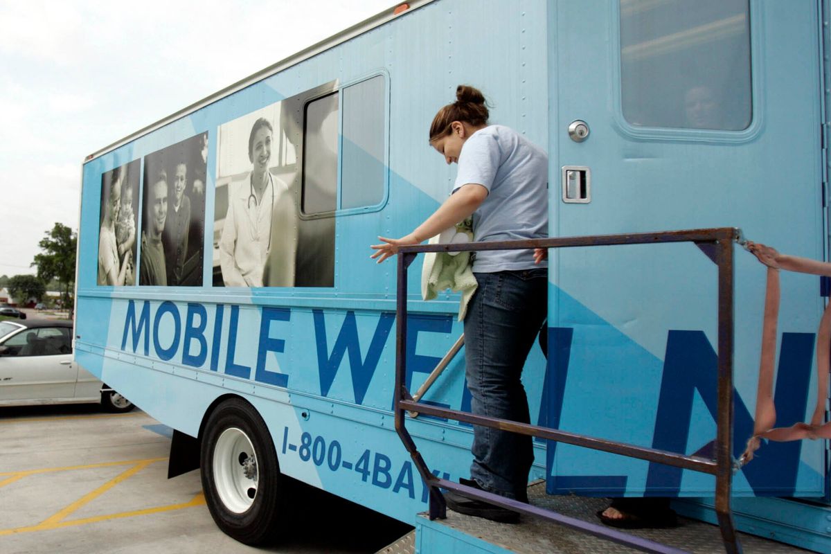 FILE - Leslie Rosas, 15, leaves the mobile health clinic with her one-month-old daughter Cielo Angela Carrizalez after their checkup at the mobile health clinic in Garland, Texas, on April 11, 2006. The clinic is just one way of helping teen mothers in Texas. States with some of the nation