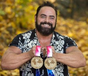 Mike Beggs can add these two silver medals to his collection after he won the pair at the World Amateur Arm Wrestling championships, Oct.18, 2015, in Buena Park, California. He now has a total of 177 medals and trophies. (Dan Pelle/SR photo)