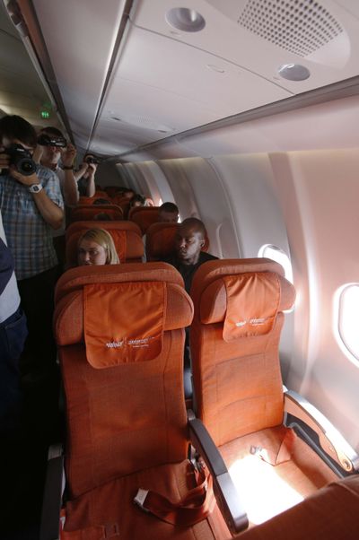 Photographers take pictures of seat 17A, right, the empty seat that an Aeroflot official said was booked in the name of former CIA technician Edward Snowden, during Aeroflot flight SU150 from Moscow to Havana on Monday. (Associated Press)