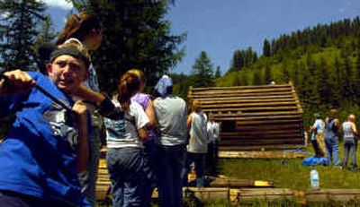 
Tony Craigie, 13, of Apple Valley, Minn., helped let down the peak beam from the homestead of Frank 