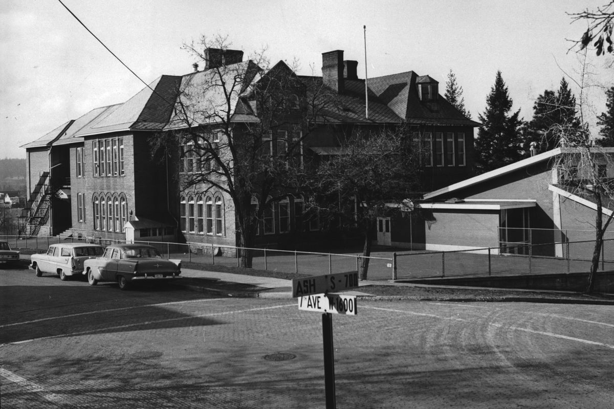 1966: Irving Elementary School at 7th Avenue and Ash Street was the oldest school in use in Spokane when it was torn down in 1973. By that time, the downtown population of families with children had moved to the suburbs and away from the neighborhood. The 1961 addition, seen at right, was left standing and the property was later sold to the Spokane Elks Lodge. The building today is the Alano Club, where Alcoholics Anonymous programs are held.  (The Spokesman-Review photo archive)