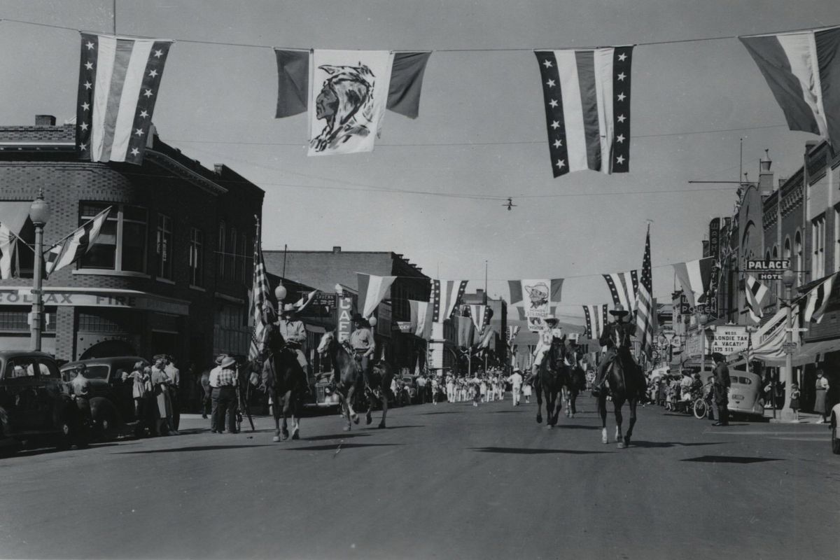 A parade goes through downtown Colfax in 1940.  (The Spokesman-Review photo archive)
