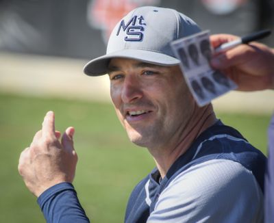 Mt. Spokane baseball coach Alex Schuerman in a relaxed moment during a game in 2019.   (DAN PELLE)