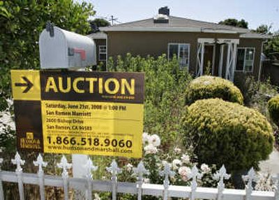 
An auction sign is posted Thursday at a house under foreclosure in East Palo Alto, Calif. Associated Press
 (Associated Press / The Spokesman-Review)
