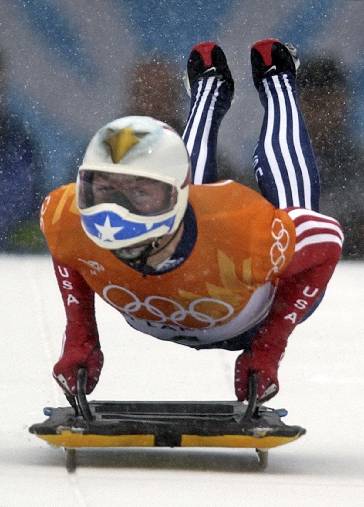 FILE - In this Feb. 20, 2002, file photo, Jimmy Shea of the United States pushes off during the men