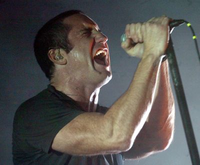 With his cropped hair and new clean-cut image, Trent Reznor brings a different look to Nine Inch Nails. (Associated Press)