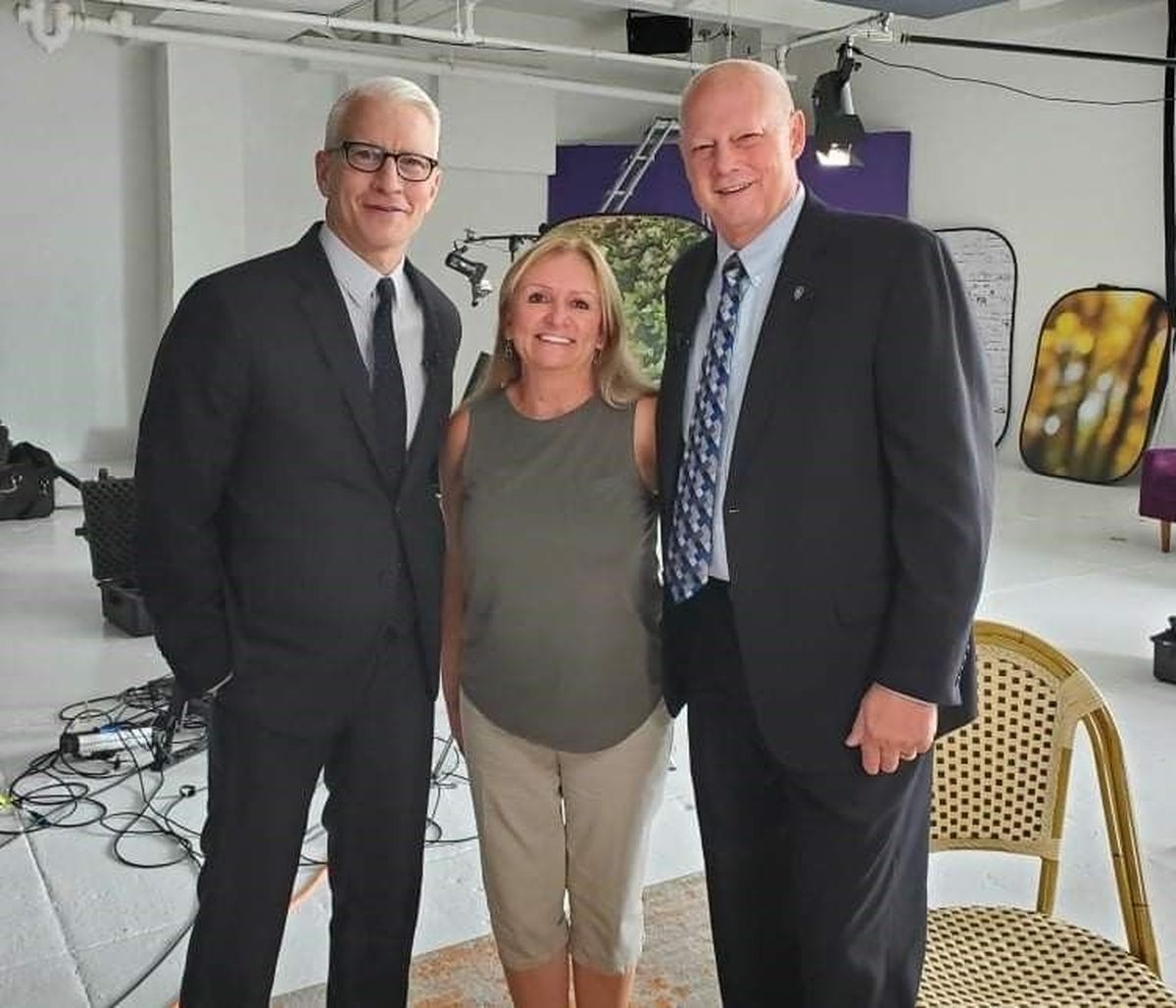 Broadcast journalist Anderson Cooper, left, poses with Pullman Police Chief Gary Jenkins and his wife, Malinda, following his “60 Minutes” interview done in New York City on Aug. 3.  (Courtesy of Gary Jenkins)
