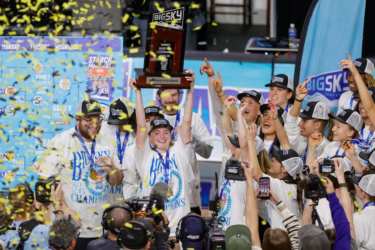 Idaho head coach Arthur Moreira celebrates with the Big Sky Championship trophy with his players after defeating Montana State at the ICCU Arena in Boise, Idaho. Photo by Steve Conner  (Steve Conner)