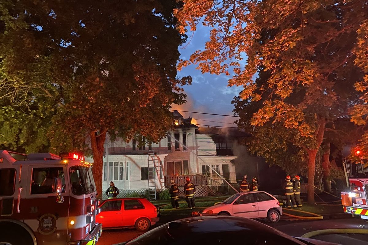 Two people died early Monday in a fire that gutted two apartment buildings in Browne’s Addition.  (Emma Epperly/The Spokesman-Review)