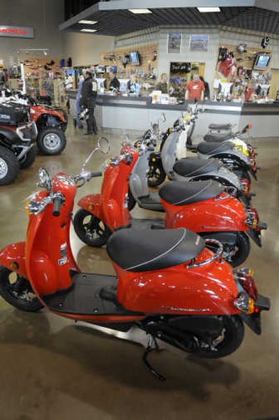 
Honda Metropolitan scooters line the showroom at Allsport Polaris Honda in Liberty Lake.  The Metropolitan averages 100 miles per gallon and can park almost anywhere. 
 (Photos by Christopher Anderson / The Spokesman-Review)