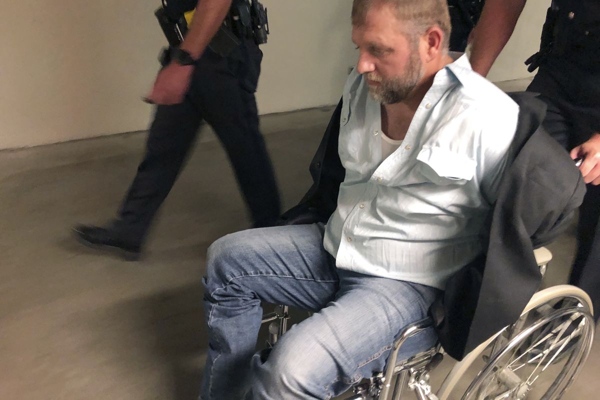 Anti-government activist Ammon Bundy is wheeled from the Idaho Statehouse on Aug. 26 following his second arrest for trespassing in two days.  (Keith Ridler)
