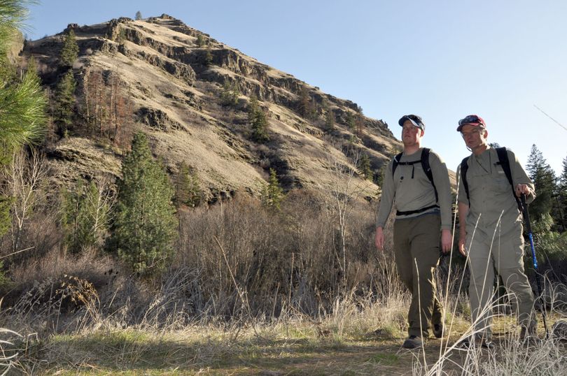 Myles Heistad, left, and Scott Wolff hike the trail along the North Fork of Asotin Creek before buds have opened on trees and plants in the foothills of the Blue Mountains of southeastern Washington. (Rich Landers)