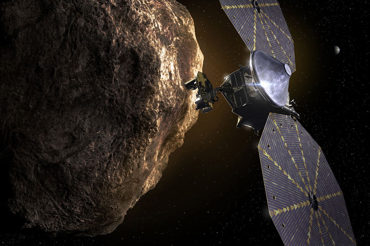 This image depicts the Lucy spacecraft approaching an asteroid. It will be first space mission to explore a diverse population of small bodies known as the Jupiter Trojan asteroids.  (HONS)