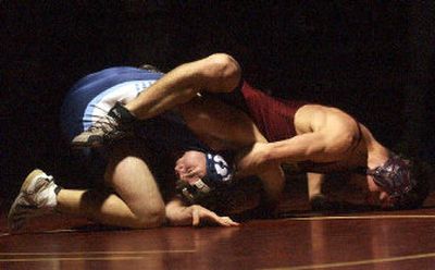 
University's Trevor Robb, right, puts the squeeze on Central Valley's Jordan Choate on the way to a second-round pin in Thursday's 152-pound match at CV. 
 (Brian Plonka / The Spokesman-Review)