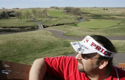 
Bob Larsen, a member of the Lower Sioux Tribe, looks out on the course at the Dacotah Ridge Golf Club from the deck of the clubhouse in Morton, Minn. The tribal-owned course is part of the Jackpot Junction casino complex. 
 (Associated Press photos / The Spokesman-Review)