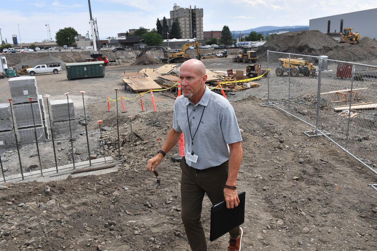 Greg Forsyth, director of Capital Projects for Spokane Public Schools, leads a tour Wednesday through the construction site for the downtown stadium project in Spokane.  (Tyler Tjomsland/The Spokesman-Review)
