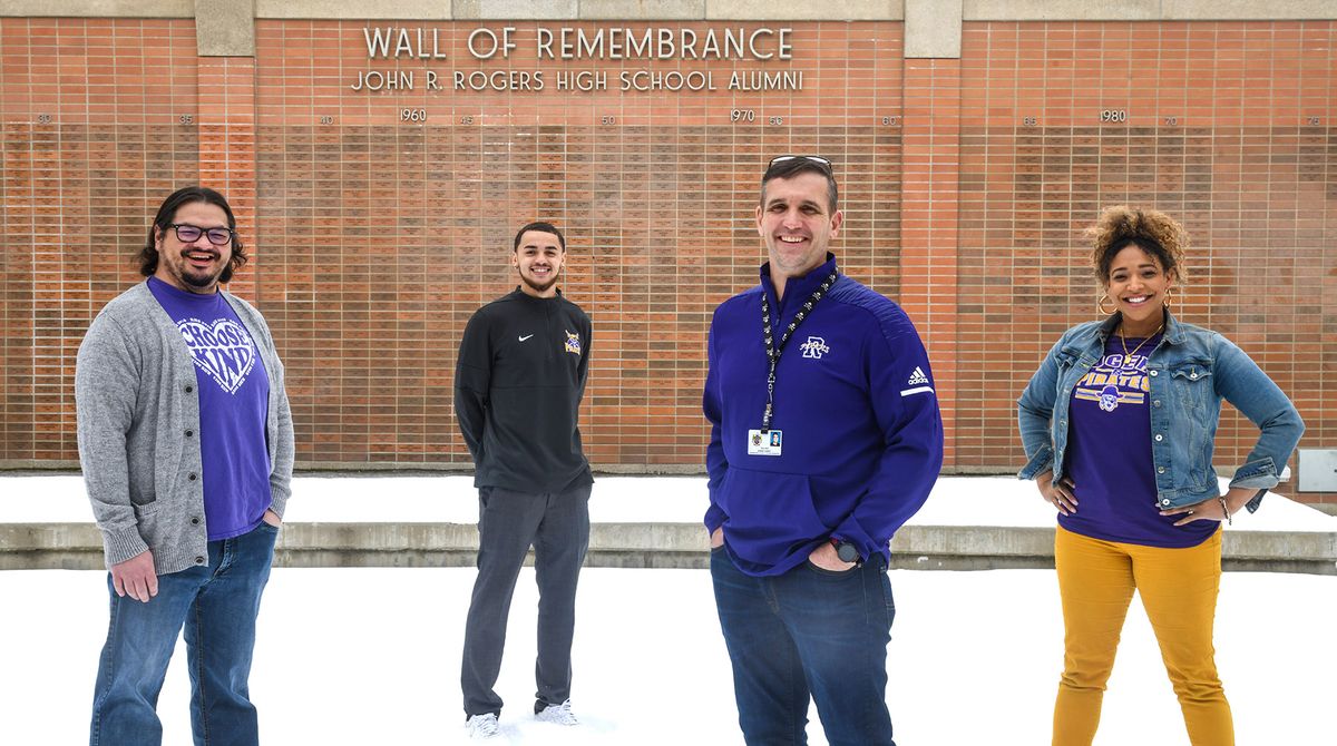 Former John Rogers High School students, from left, Matt Bland, class of 1995, now a multi-tiered support specialist; Khalil Winfrey, class of 2016, academic support specialist; Shawn Carney, class of 1991, science teacher; and Natalie Wiley, class of 2004, mental health therapist, have all returned to their old school.  (Dan Pelle/THESPOKESMAN-REVIEW)