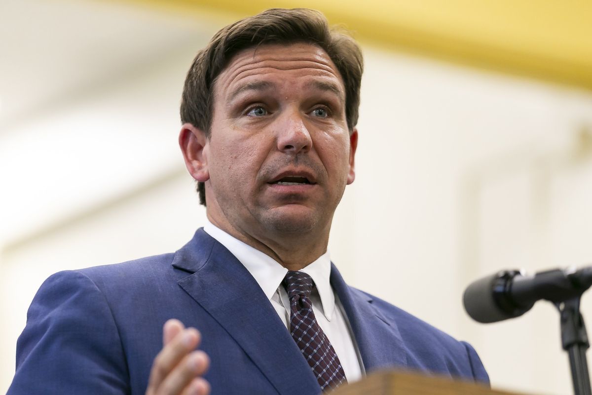 Florida Gov. Ron DeSantis, center, speaks during a news conference May 4, 2021, at West Miami Middle School in Miami. Several states scaled back their reporting of COVID-19 statistics this July 2021, just as cases across the country started to skyrocket, depriving the public of real-time information on outbreaks, cases, hospitalizations and deaths in their communities.  (Matias J. Ocner)