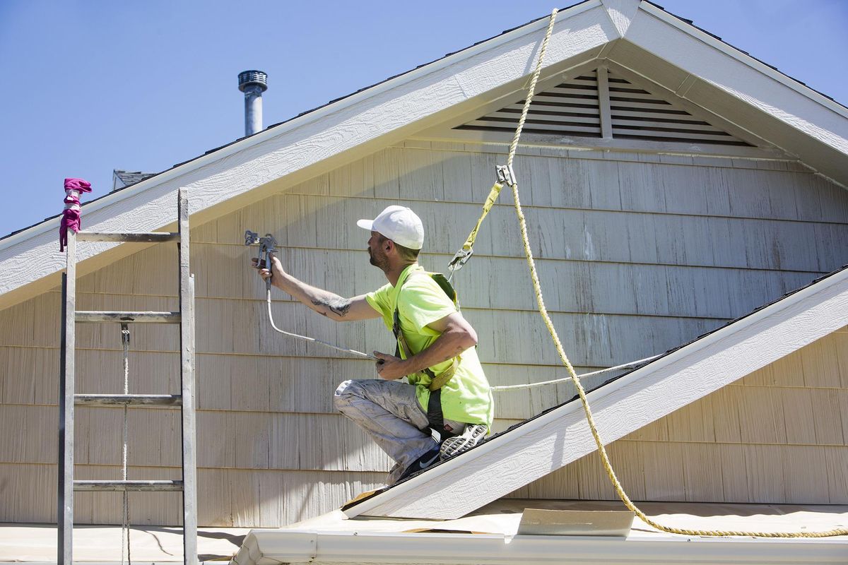 Although being tethered to a harness is more of a hassle because of the frequent adjustments, each adjustment makes workers aware, says Risa Roe, who oversees safety at Adam Roe Painting. (Katherine Jones / Katherine Jones/Idaho Statesman)