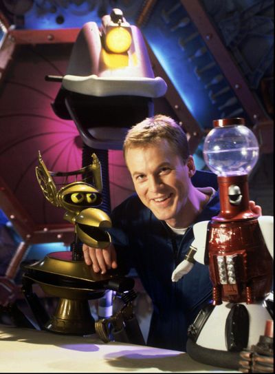 The 1997 version of “Mystery Science Theater 3000” featured host and head writer Mike Nelson, along with the robots Crow, left, Gypsy, center, and Tom Servo, right. Classic episodes are coming to Netflix this week, with new episodes available to stream in April. (MIKE KIENITZ / Associated Press)