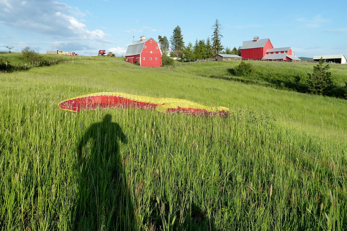 Paraglider Matt Senior of Seattle landed at a farm near Deary, Idaho, after flying 180 miles from Chelan Butte to set a Washington free flight distance record.